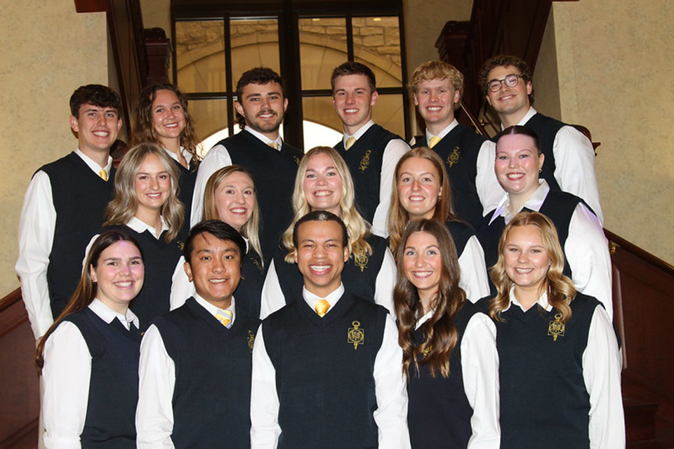 Senior students smile for a group photo. 