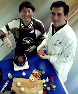 Daniel Y.C. Fung and assistant with food