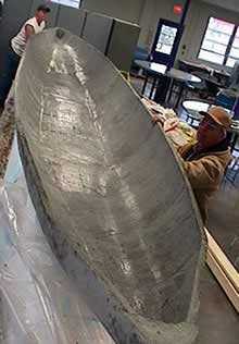 people making a concrete canoe