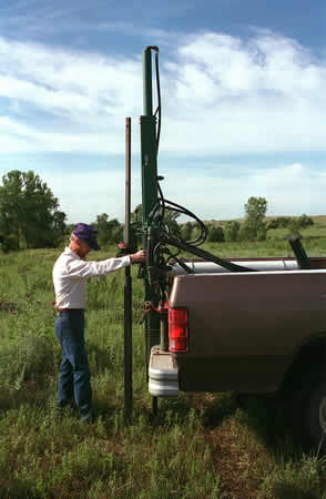 William uses machine in the back of his truck to test the soil