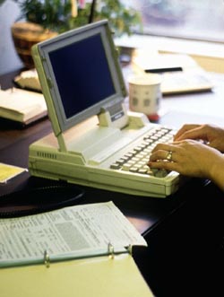woman typing at keyboard