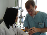 David Hodgson and student treating a patient