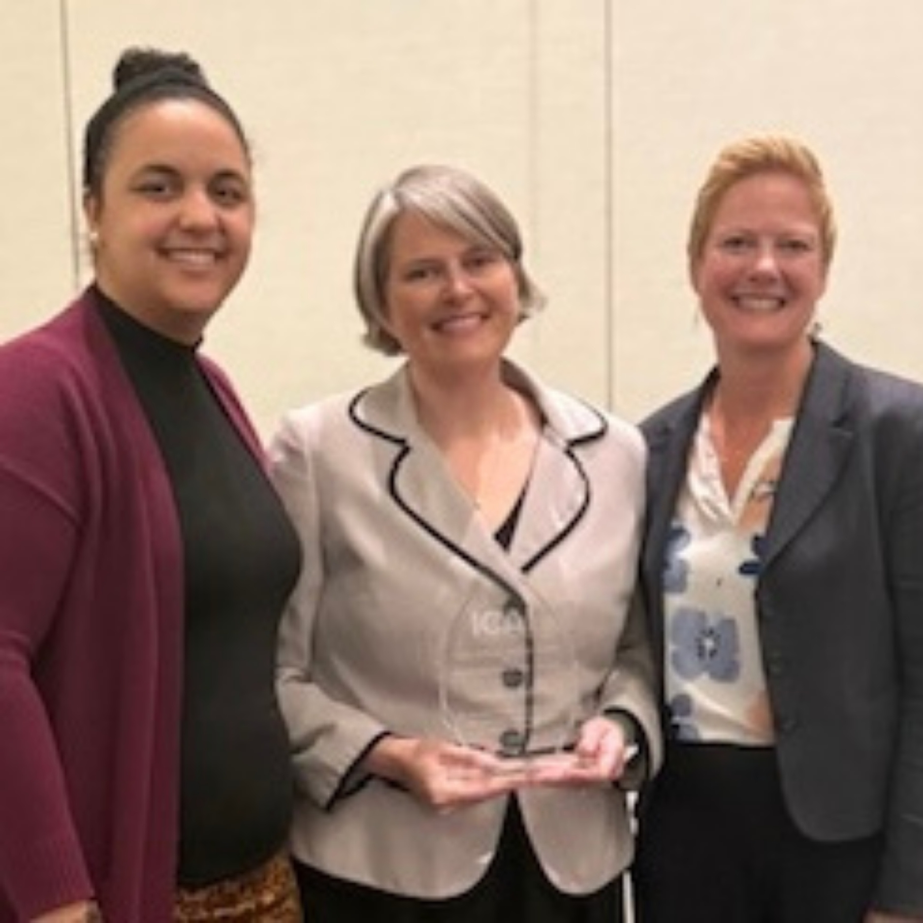 Camilla Roberts poses with her award