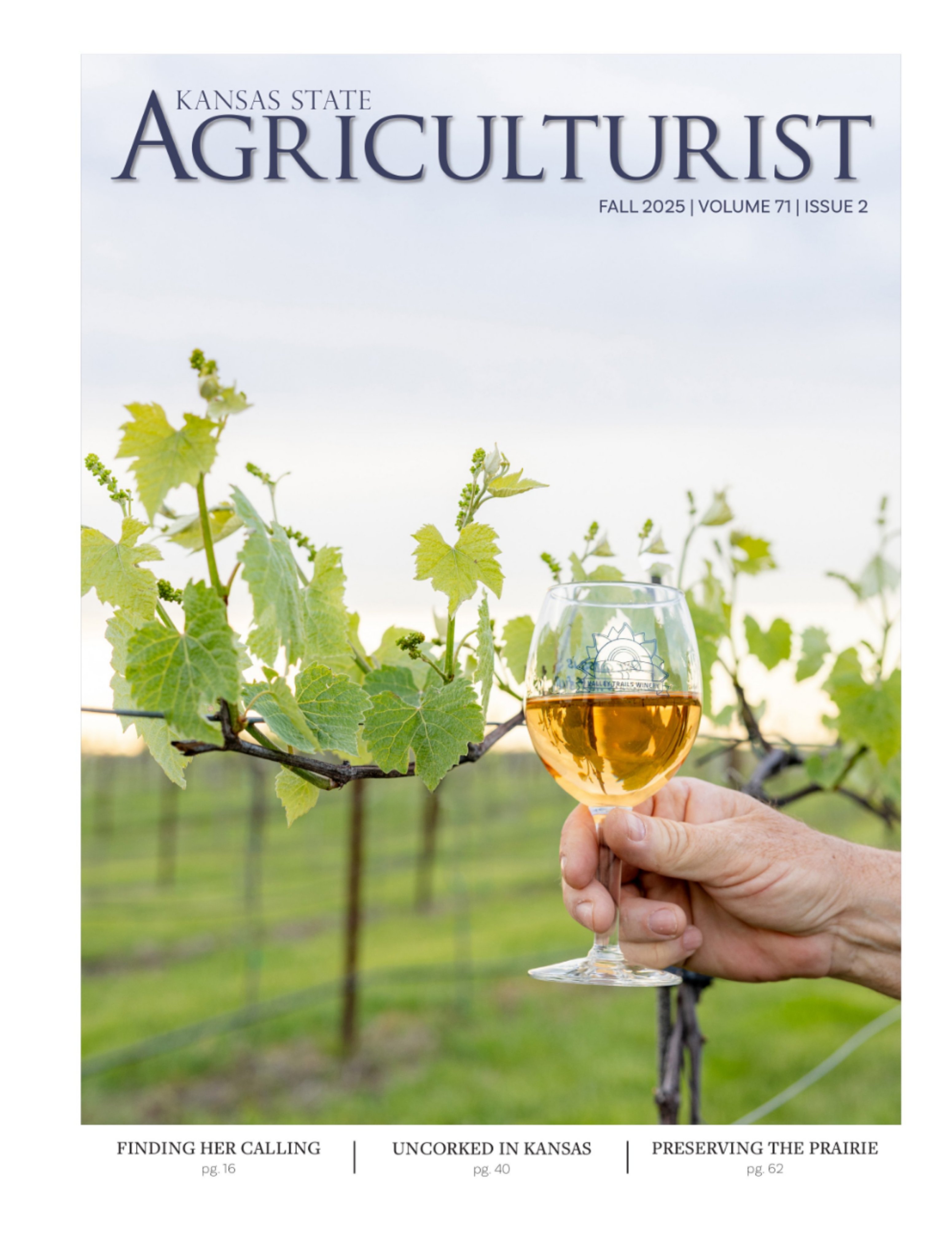 Cover of the Fall 2025 Agriculturalist, featuring a hand holding a glass of wine with a vineyard present in the background