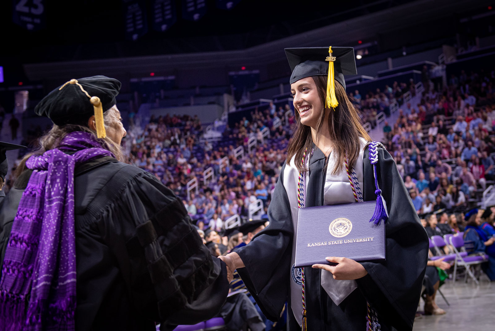 graduate accepting diploma