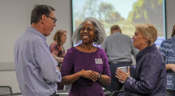 Three K-State employees chat.