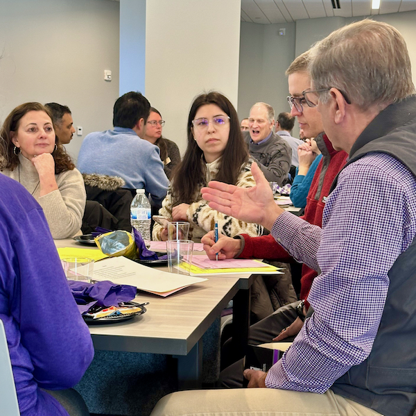 a group of scientists discuss a new project