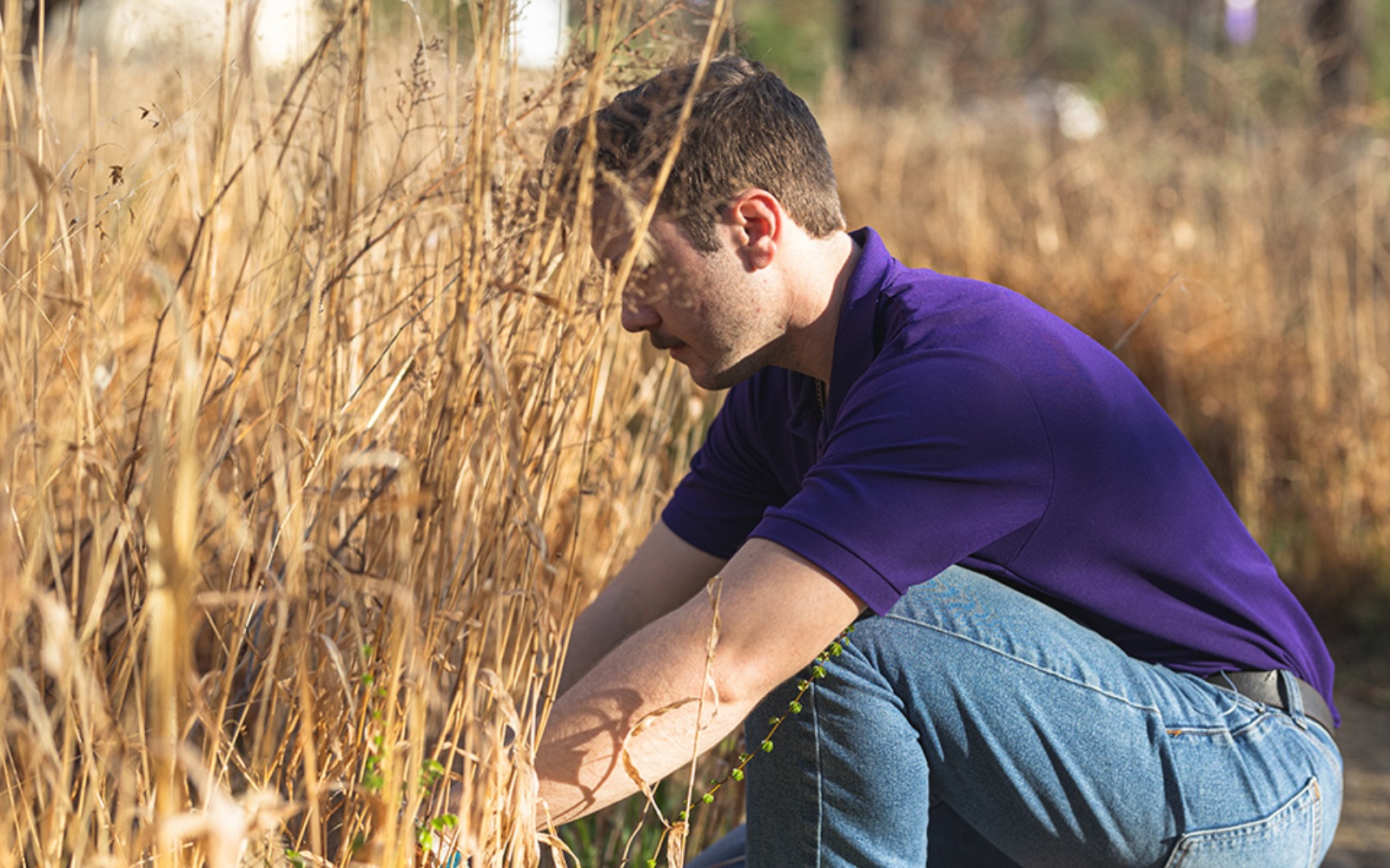 A student works on something in a field.