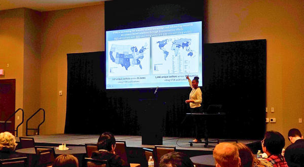 OEIE team member presenting data on maps