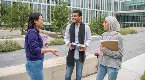 International students talking on K-State campus