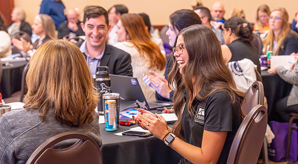 Students and industry professionals networking