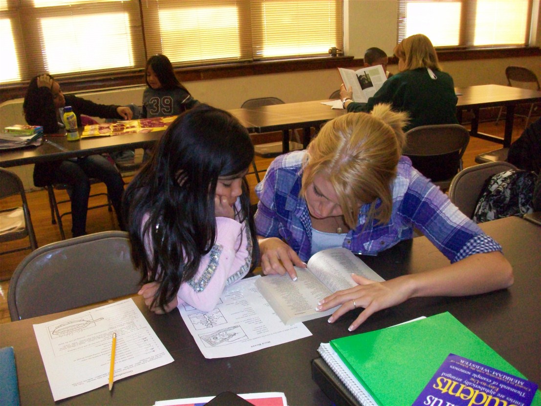 Elizabeth Zabel tutors a student at the Douglass Center.