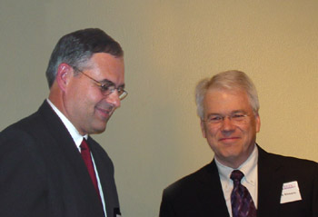 John Unruh receives the award from Ronnie Elmore presents the award.