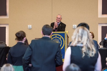 Candid photos of initiates taking the oath