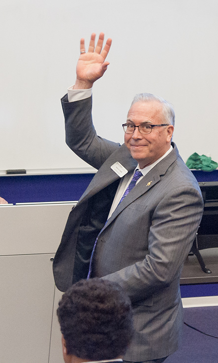 Past-President Clark waves to the audience