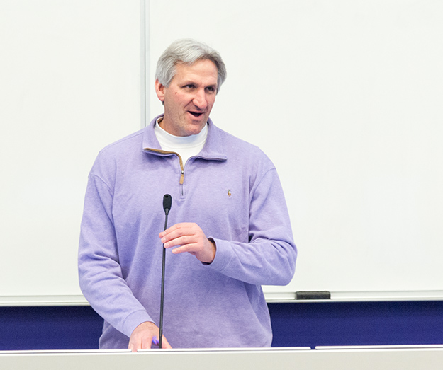 Dr. John Buckwalter, Dean of the College of Human Ecology initiates members from his college