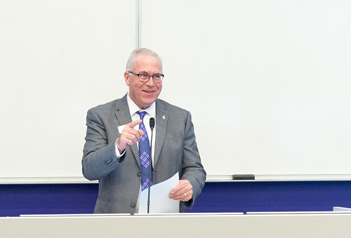 Dr. Gary Clark, Associate Dean of Engineering and PKP past president initiates members from his college