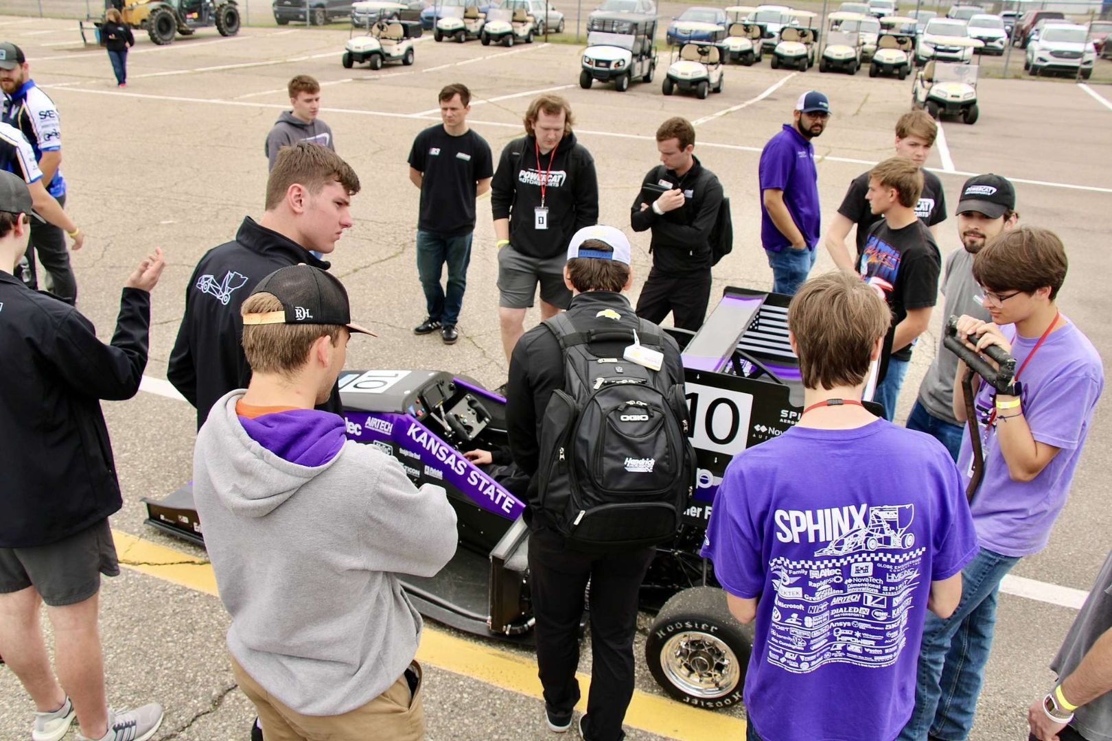 The team talks about the car to other teams 