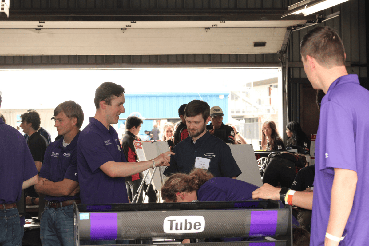 Tyler weber the aero lead explains his design to the aero judge