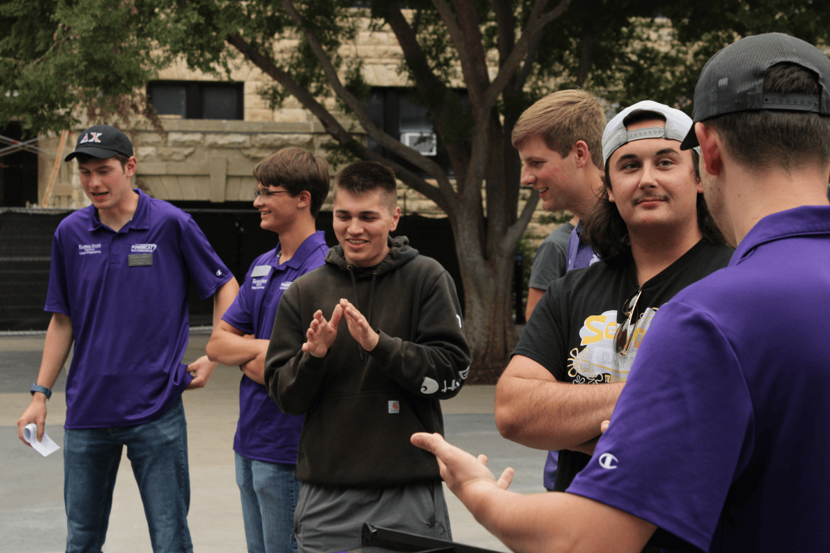 Mutliple team members talk to prospective students