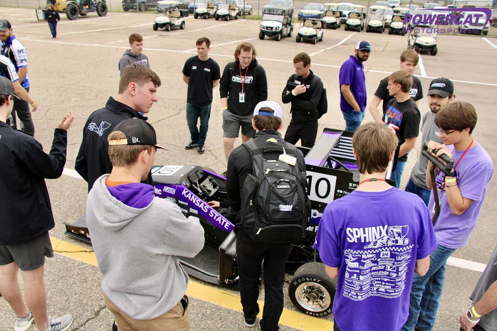 The team shows off the car to other teams at comp