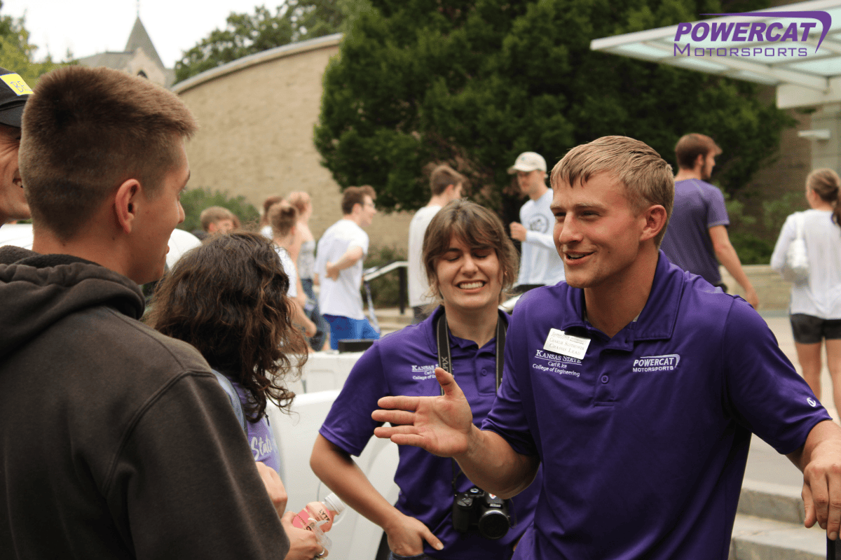 Charlie the chasis lead happily talks to a prospective student