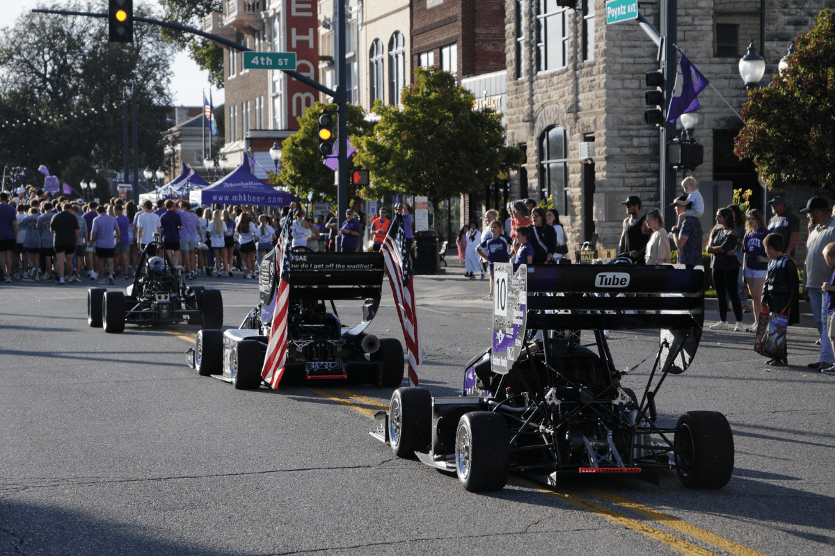 New Members view the older cars in the shop New Members view the older cars in the shop