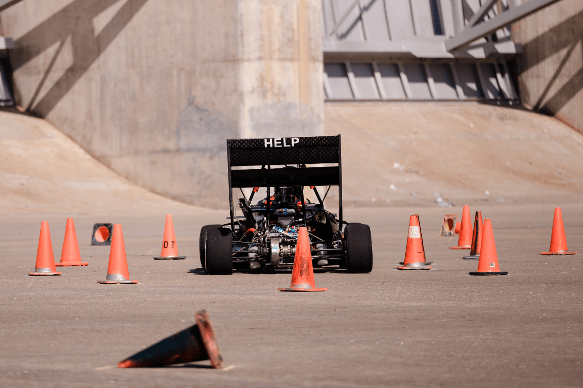 UNL goes through a corner showing the rear wing quote to the camera