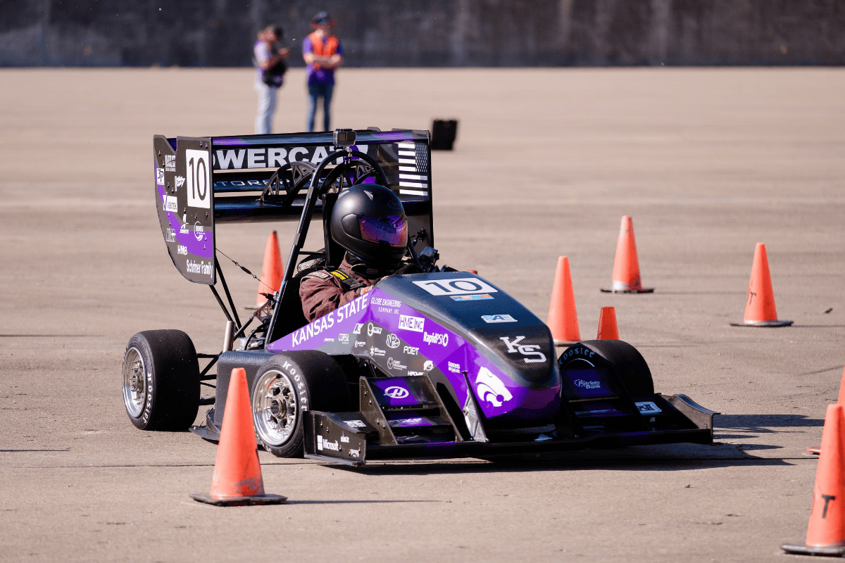The team shows off the car to other teams at comp The team shows off the car to other teams at comp