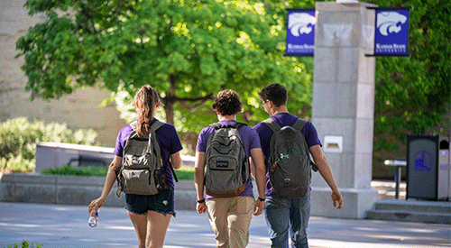 Three K-State students cross Bosco Plaza.
