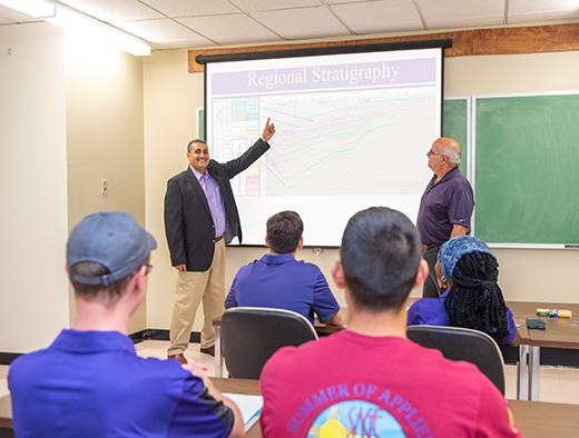 Abdelmoneam Raef, left, and Matt Totten, associate professors of geology at Kansas State University, will use Schlumberger software modules in research and teaching to address petroleum production problems in Kansas.