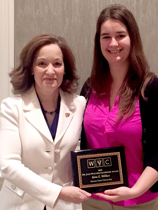 Bonnie Rush, left, interim dean of the Kansas State University College of Veterinary Medicine, and Sara Wilkes, a third-year veterinary medicine student, hold the Dr. Jack Walther Leadership Award that Wilkes received at a national veterinary conference.