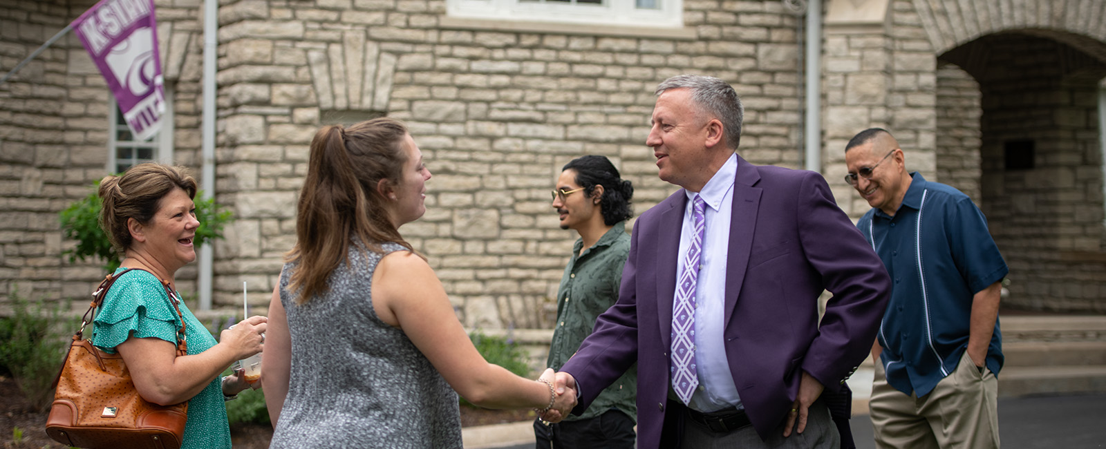 President Linton shaking hands