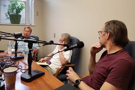 Guests discuss global foods topics during a podcast recording.
