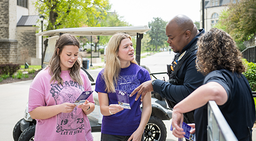 students talking to officers