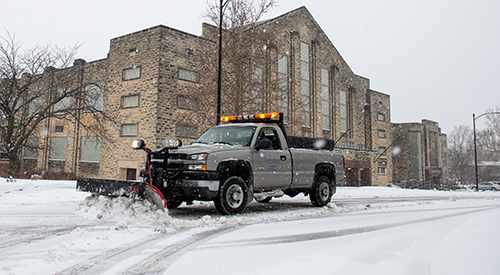 a snow plow in front of Ahearn