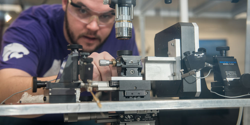 person looking at equipment in an engineering lab
