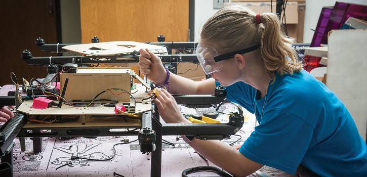 The unmanned aerial systems team works in the laboratory. 