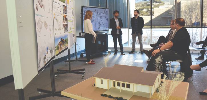Students present their designs and get feedback.