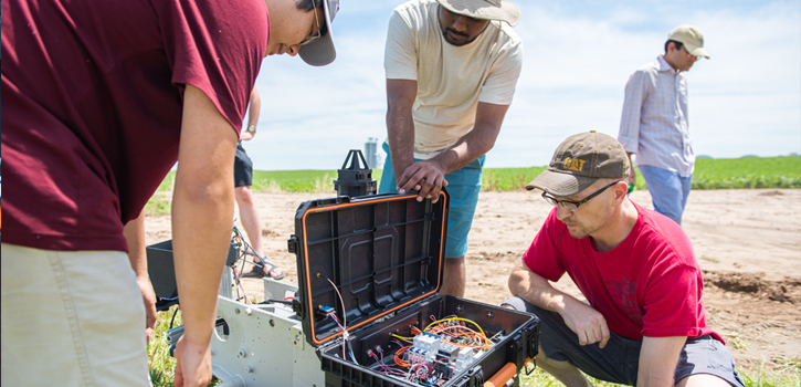 K-State researchers work on robotic tractor. 