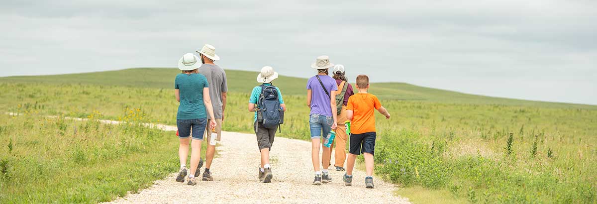 A family enjoys a walk outside. 