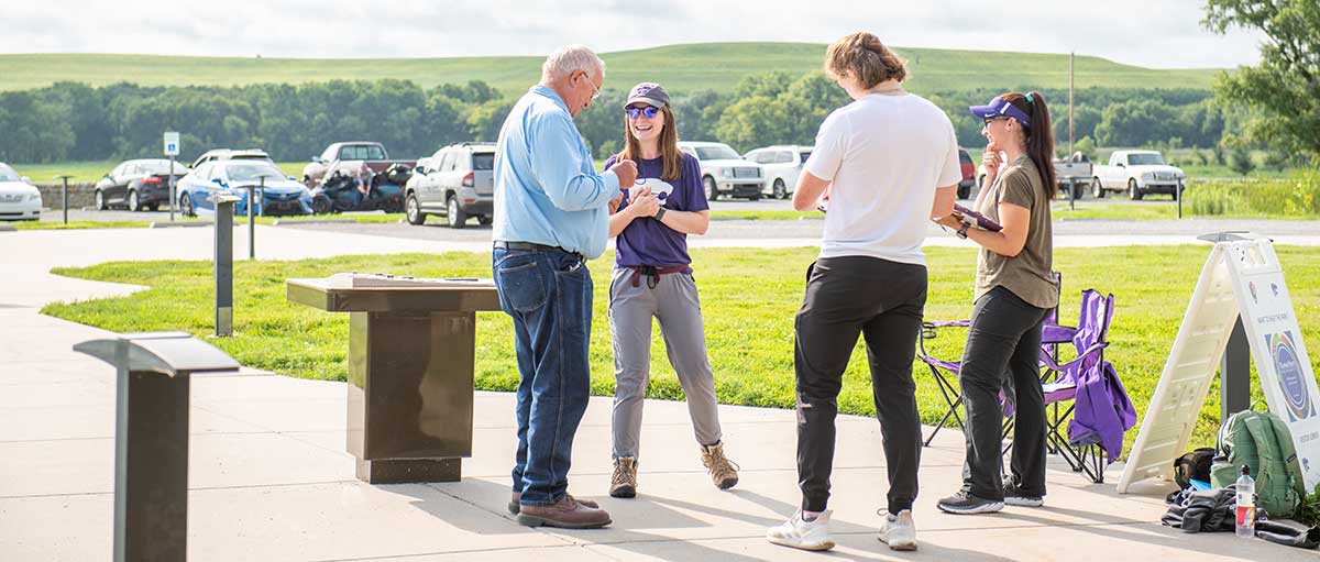 Students meet with visitors at the Tallgrass National Prairie Preserve.