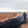 The burn crew splits in two and moves in opposite directions around the area that is being burned to light flank fires to contain the fire to the assigned watershed.