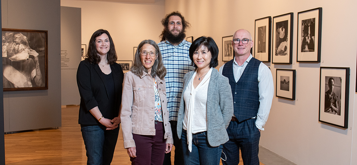 Members of the Gordon Parks research team stand in front of the exhibit. 