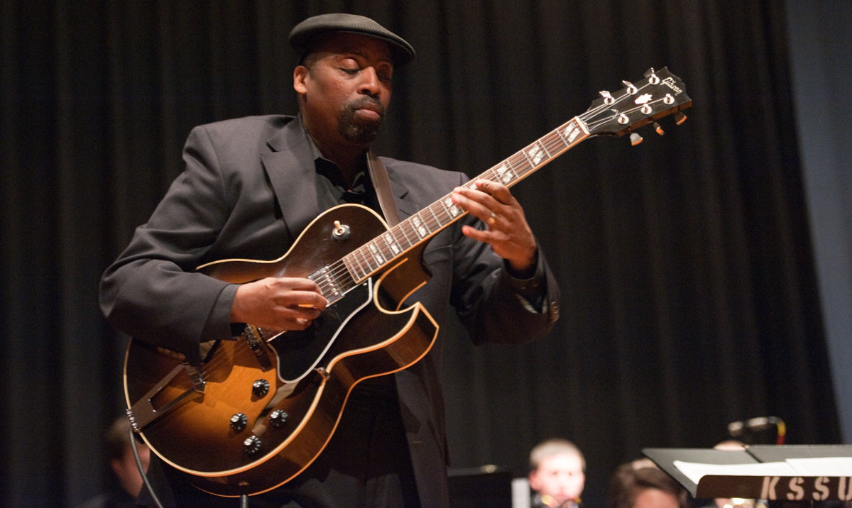 Wayne Goins performs on the guitar.