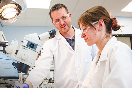 Stephen Copp, left, and doctoral student Ashley Baranczuk examine how human body functions, such as blood pressure and heart rate, respond to exercise as part of research to better understand cardiovascular function.