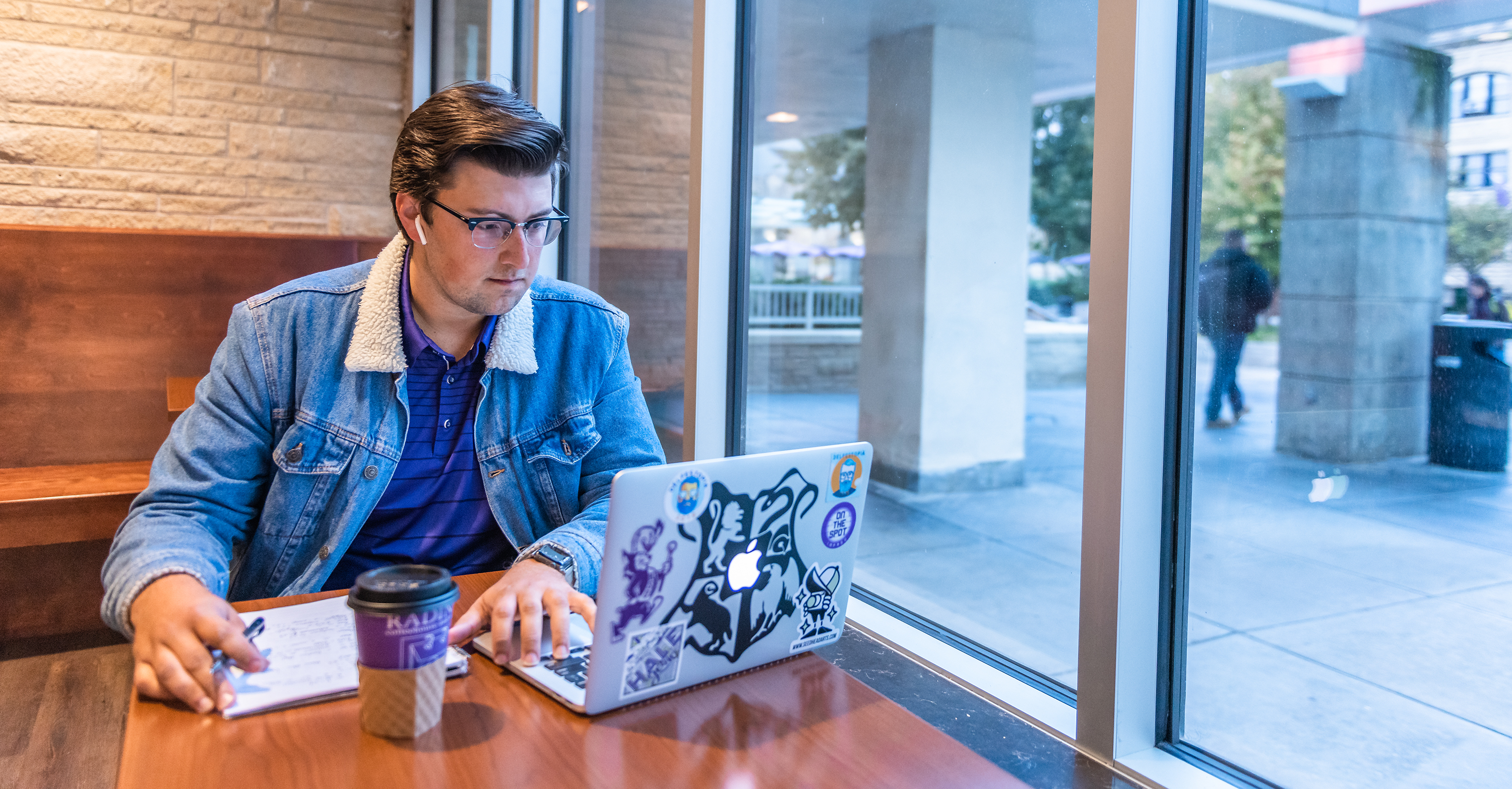 Student studying and drinking coffee in the student union