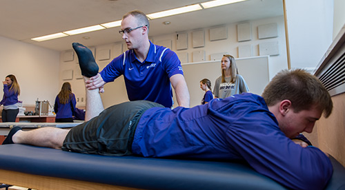 Student doing physical therapy