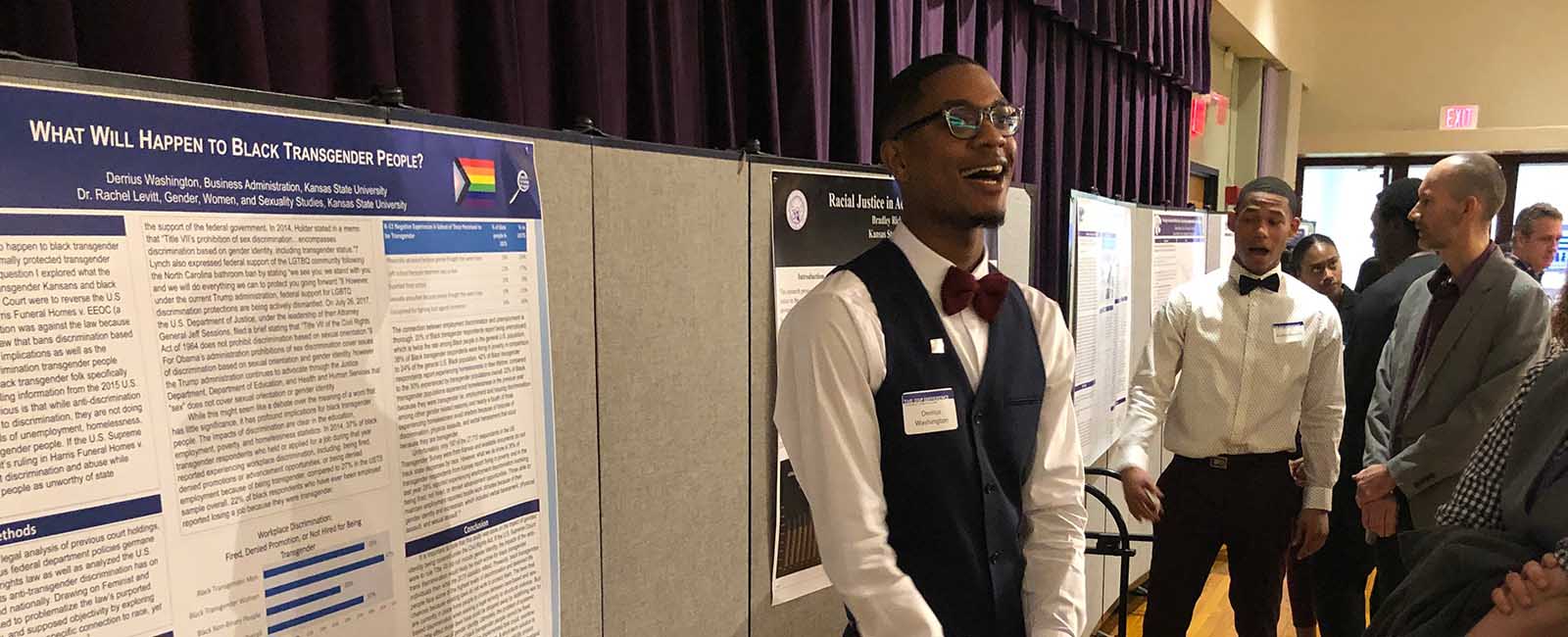 Derrius presenting research poster