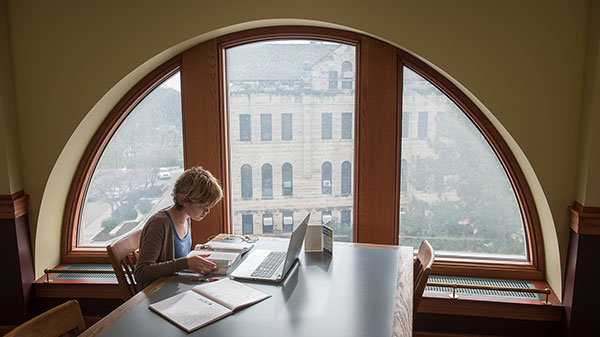 Student studying at the library